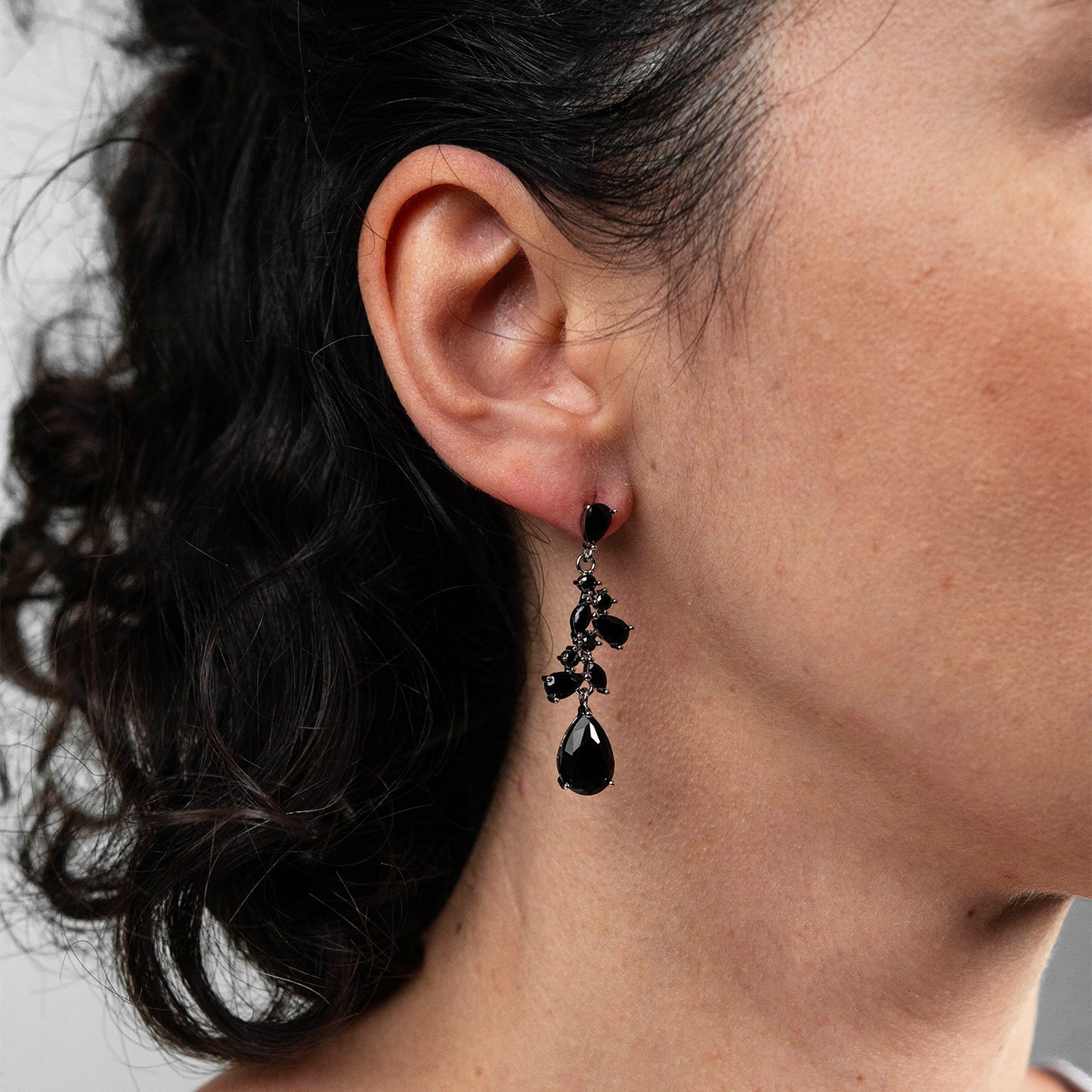 Silver earrings with black stones.