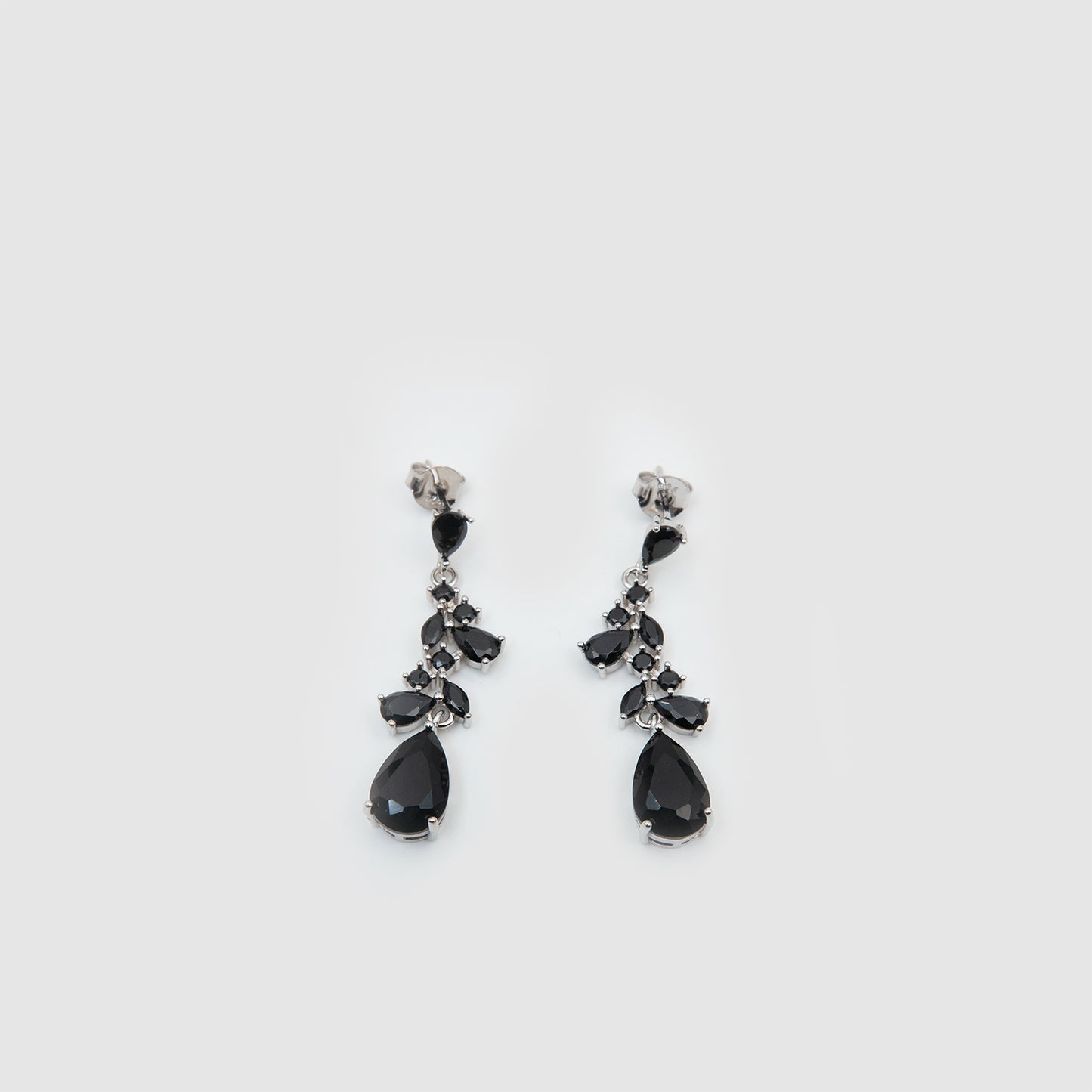 Silver earrings with black stones.