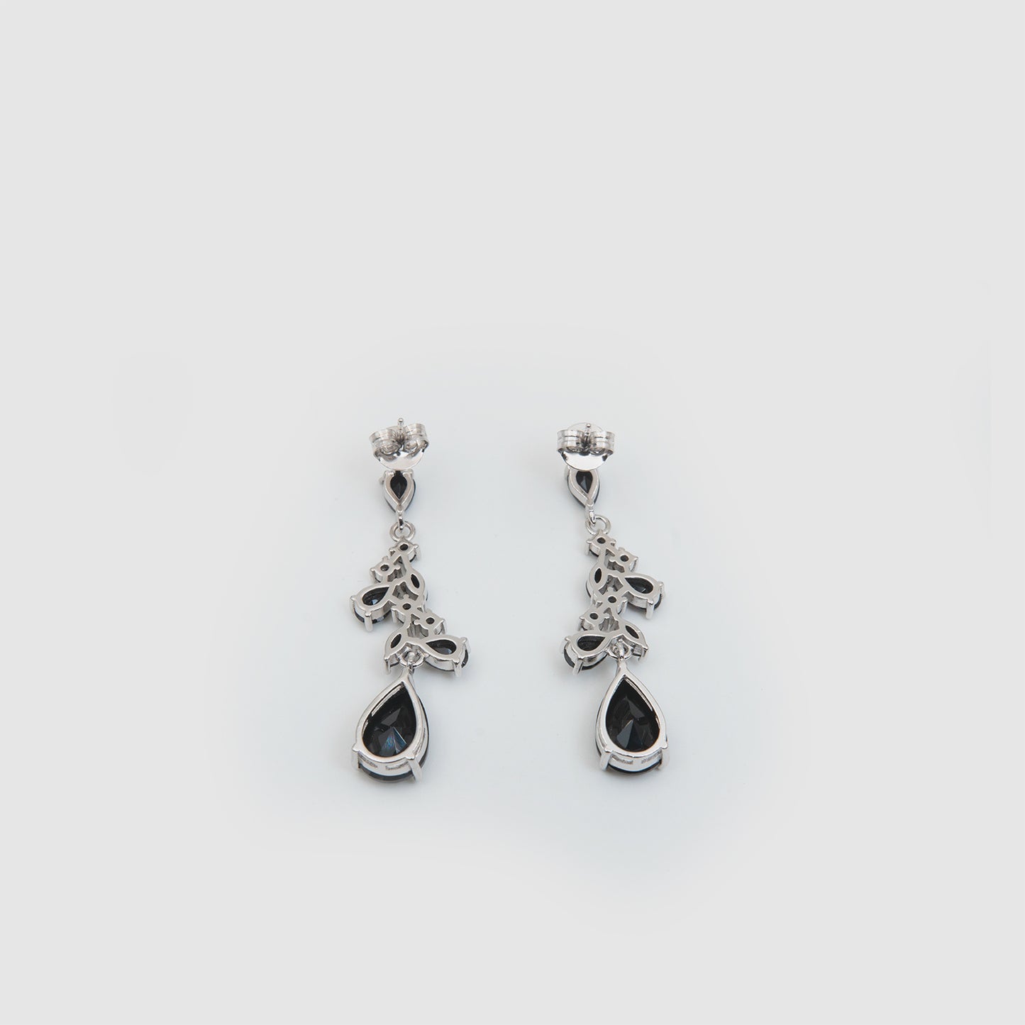 Silver earrings with black stones.