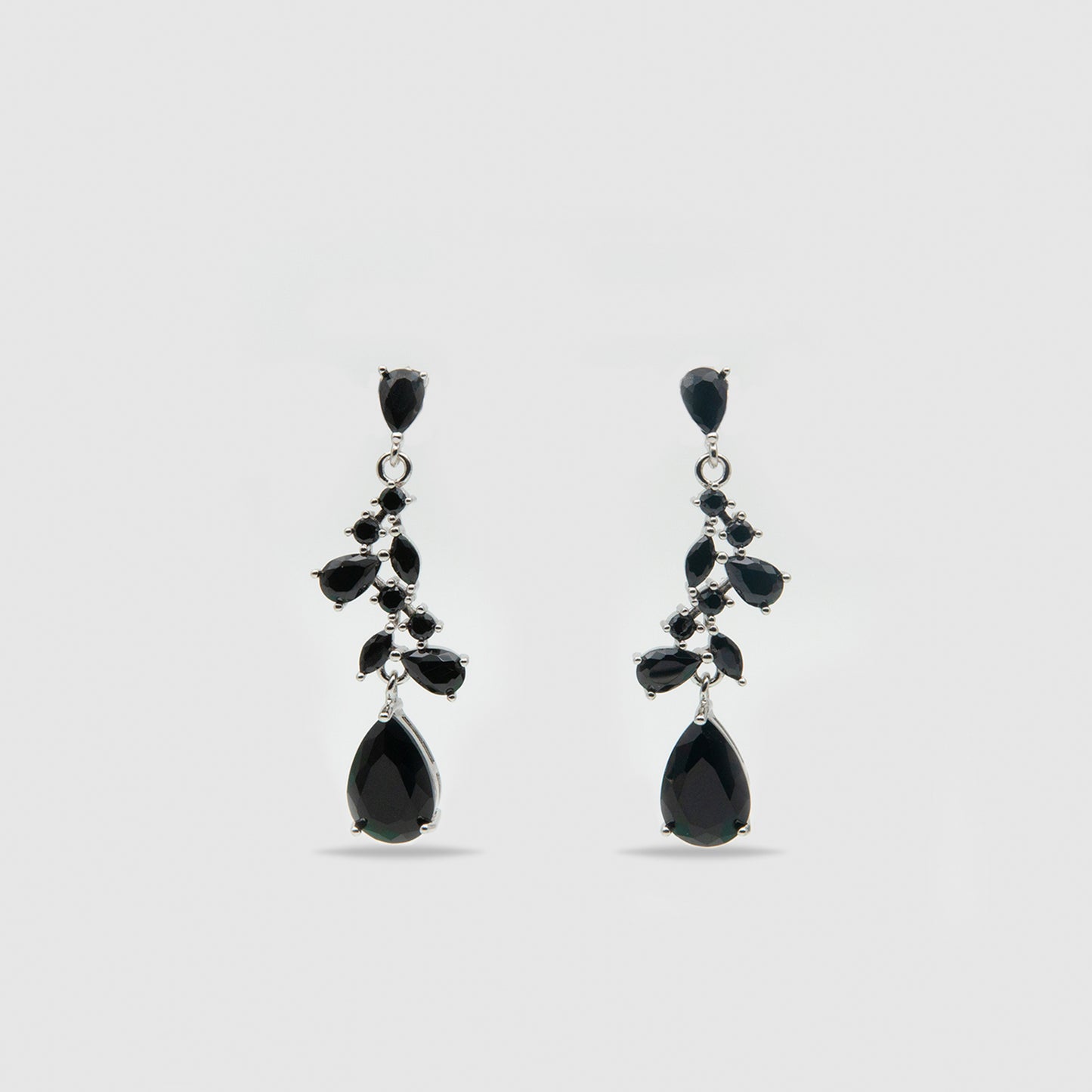 Silver earrings with black stones.